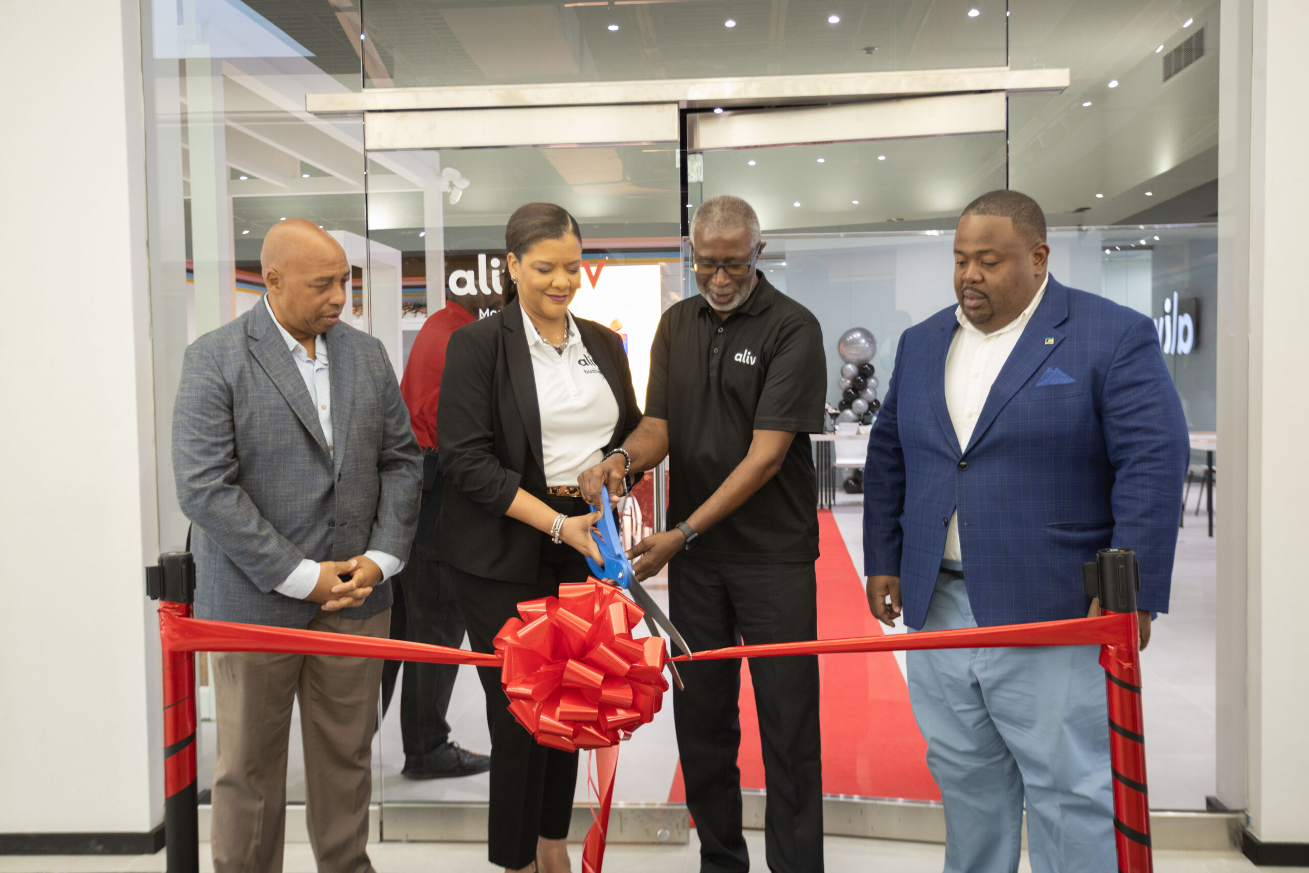 Cable Bahamas leadership ribbon cutting at new ALIV location